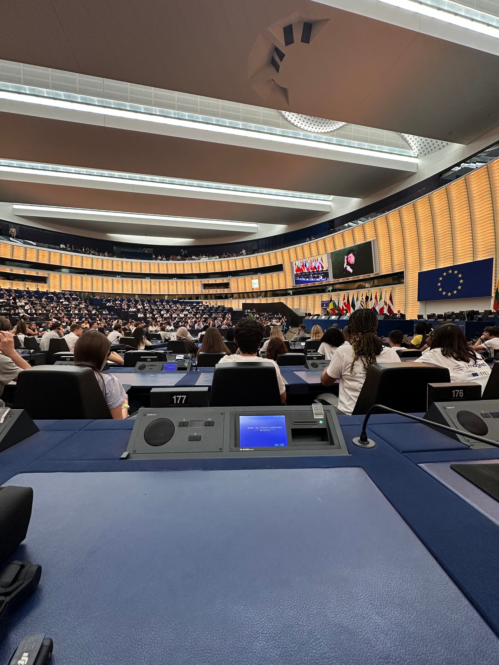 Wide view of the European Parliament hemicycle chamber in Strasbourg during a youth event